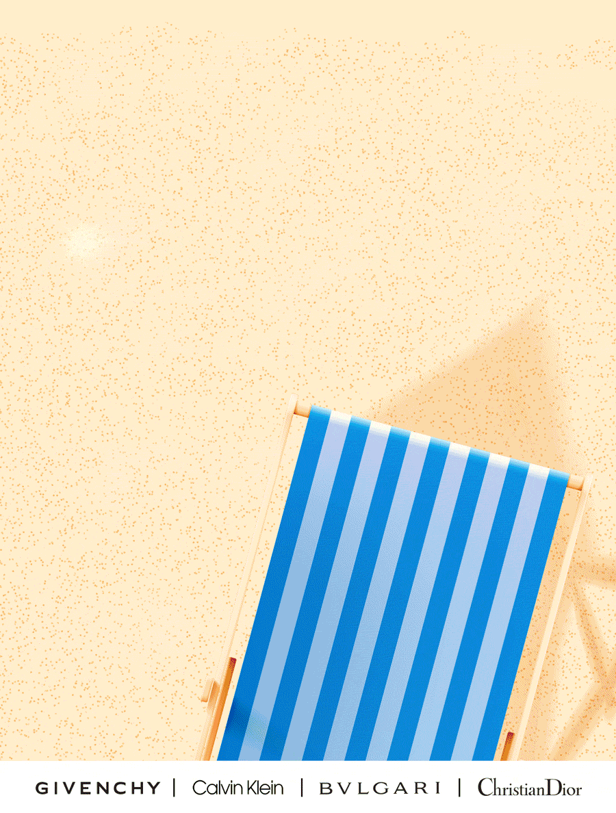 Best selling fragrances lay out on a summer beach setting