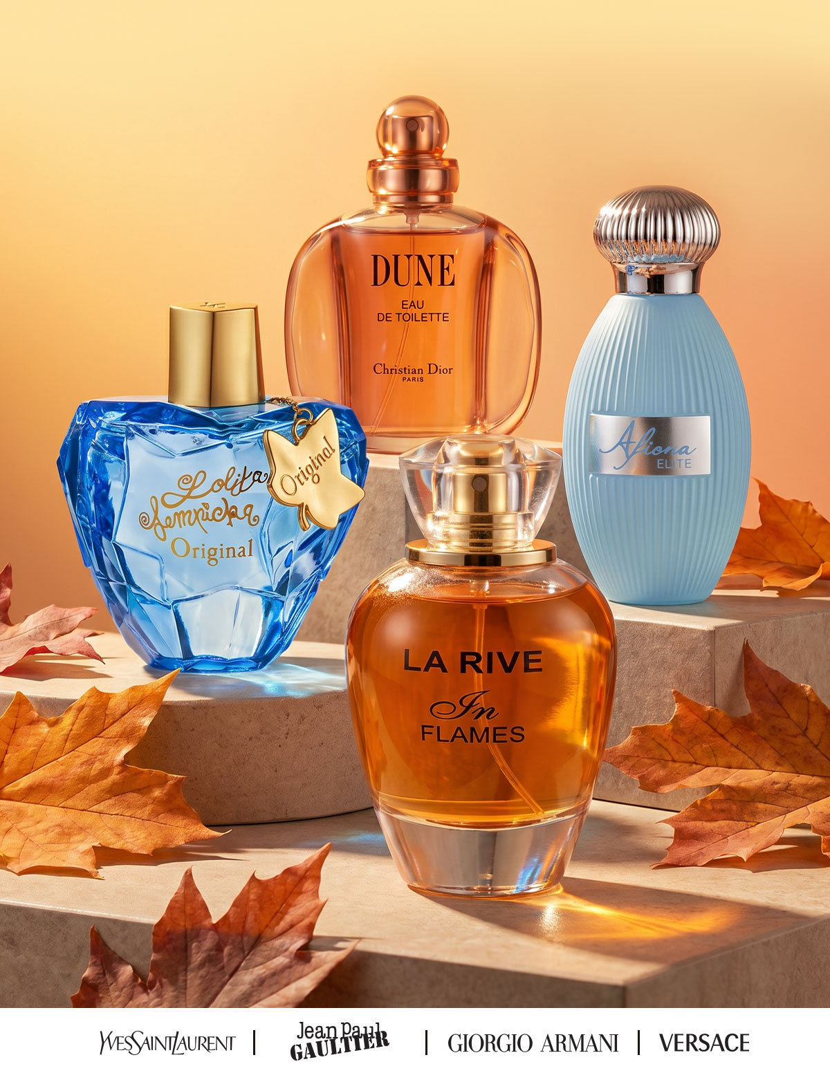 An elegant display of popular fragrances scattered with autumn leaves